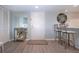 Entryway featuring a modern countertop, mirror, and wall decor at 1080 Peppertree W Ln # 602, Sarasota, FL 34242