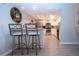 Modern kitchen with white cabinetry, stainless steel appliances, and updated lighting, offering a clean design at 1080 Peppertree W Ln # 602, Sarasota, FL 34242