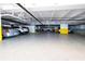 Well-lit parking garage featuring assigned spots, security cameras, and easy access to the building at 1080 Peppertree W Ln # 602, Sarasota, FL 34242