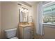 Bathroom featuring a vanity, mirror, and window with natural light at 111 Faubel St, Sarasota, FL 34242