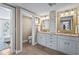 Bathroom featuring double vanity, drawers, and a separate toilet room for added privacy at 111 Faubel St, Sarasota, FL 34242