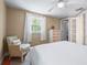 Inviting bedroom with natural light, chair, hardwood floors, closet and a comfortable bed at 111 Faubel St, Sarasota, FL 34242