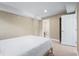 This bedroom features neutral walls, access to a private bathroom, and a comfortable bed at 111 Faubel St, Sarasota, FL 34242