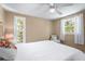 Inviting bedroom with natural light, chair, and a comfortable bed at 111 Faubel St, Sarasota, FL 34242