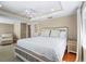 Spacious bedroom with recessed lighting, ceiling fan, chair and a comfortable bed at 111 Faubel St, Sarasota, FL 34242