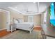 Beautiful bedroom with recessed lighting, ceiling fan, dresser, and tropical beach scene on TV at 111 Faubel St, Sarasota, FL 34242