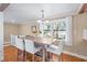 Dining area with a view to the staircase and outside scenery at 111 Faubel St, Sarasota, FL 34242