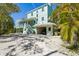 Beautiful home with a garage and lush tropical landscaping, located in a desirable area at 111 Faubel St, Sarasota, FL 34242