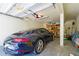 A well-organized garage houses a sleek Porsche 911 Carrera S, offering secure parking at 111 Faubel St, Sarasota, FL 34242