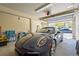 Spacious garage featuring a sleek car with an automatic door, ideal for easy access at 111 Faubel St, Sarasota, FL 34242