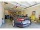 A clean garage houses a sleek Porsche 911 Carrera S, offering secure parking at 111 Faubel St, Sarasota, FL 34242