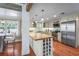 Kitchen with stainless steel appliances, butcher block island, and ample storage at 111 Faubel St, Sarasota, FL 34242