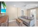 Living room with tile floors, comfortable furniture and a view to the outside at 111 Faubel St, Sarasota, FL 34242