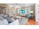 Bright living room with modern furnishings, hardwood floors, and a flat-screen TV at 111 Faubel St, Sarasota, FL 34242