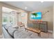 Inviting living room featuring a TV, seating and spiral staircase to upper floors at 111 Faubel St, Sarasota, FL 34242