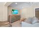 Living room featuring a modern TV, furniture and neutral color palette at 111 Faubel St, Sarasota, FL 34242