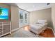 Comfortable sitting area with hardwood floors, a large rug, doors to deck, and chair with ottoman at 111 Faubel St, Sarasota, FL 34242