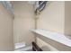 Utility room offering a shelf, wall-mounted equipment, and space-saving features at 111 Faubel St, Sarasota, FL 34242