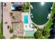 Aerial view featuring a community pool, spa, shuffleboard, boat docks and waterfront access at 1250 N Portofino Dr # 203, Sarasota, FL 34242