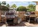 Outdoor grilling area with multiple grills and propane tanks, perfect for summer barbecues at 1250 N Portofino Dr # 203, Sarasota, FL 34242