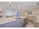 Beautiful open kitchen with granite countertops, stainless appliances, views of the living room, and access to balcony at 1250 N Portofino Dr # 203, Sarasota, FL 34242