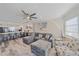 Comfortable living room featuring an open floor plan and bar seating to the kitchen at 1250 N Portofino Dr # 203, Sarasota, FL 34242