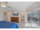 Main bedroom features ensuite bath, lanai access, and a wall mounted tv at 1250 N Portofino Dr # 203, Sarasota, FL 34242