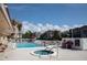 Community pool and hot tub area, perfect for relaxation and socializing with neighbors at 1250 N Portofino Dr # 203, Sarasota, FL 34242