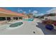 Inviting community pool with a hot tub and ample seating for residents to enjoy at 1250 N Portofino Dr # 203, Sarasota, FL 34242