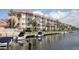 Waterfront condo building with private boat docks, offering easy access to waterways at 1250 N Portofino Dr # 203, Sarasota, FL 34242