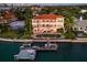 Aerial view of a luxurious waterfront home featuring a dock, swimming pool and well manicured lawn at 1378 Harbor Dr, Sarasota, FL 34239