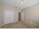 Bedroom with neutral carpet, double door closet, and neutral colored walls at 13804 Camden Crest Ter, Lakewood Ranch, FL 34211