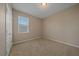 Bedroom with neutral carpet, a window with blinds, and neutral colored walls at 13804 Camden Crest Ter, Lakewood Ranch, FL 34211