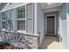 Inviting front entrance with decorative stone accents and a 'Welcome' mat for a warm and friendly greeting at 13804 Camden Crest Ter, Lakewood Ranch, FL 34211