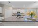 Modern kitchen featuring granite countertops and bright white cabinetry, perfect for cooking and entertaining at 13804 Camden Crest Ter, Lakewood Ranch, FL 34211