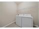 Bright laundry room featuring new washer and dryer appliances and tile flooring at 13804 Camden Crest Ter, Lakewood Ranch, FL 34211