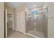 Bathroom featuring a large shower with tile surround and glass doors at 13804 Camden Crest Ter, Lakewood Ranch, FL 34211