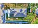 Overhead view of the house showcasing its roof, manicured lawn, and surrounding fence at 1422 19Th St, Sarasota, FL 34234