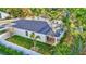 Drone shot displays an overview of the property, fenced yard, and exterior features at 1422 19Th St, Sarasota, FL 34234