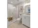 Bright bathroom featuring a glass shower, white vanity with modern fixtures, and neutral decor at 1422 19Th St, Sarasota, FL 34234