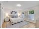 Bright bedroom features modern decor, natural light, and sleek sliding closet doors at 1422 19Th St, Sarasota, FL 34234