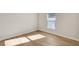 Neutral bedroom showcasing natural light and lovely wood floors, creating a serene, inviting space at 1422 19Th St, Sarasota, FL 34234