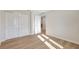 Spacious bedroom featuring wood floors, white trim, closet and interior door at 1422 19Th St, Sarasota, FL 34234