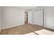 Spacious bedroom featuring wood floors, white trim, closet and interior door at 1422 19Th St, Sarasota, FL 34234