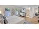 Calming bedroom showcases light wood floors, neutral colors, and ensuite bathroom access at 1422 19Th St, Sarasota, FL 34234