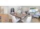 Open concept dining room with a modern table, seating for six, and stylish decor at 1422 19Th St, Sarasota, FL 34234