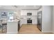 Modern kitchen featuring quartz counters, stainless appliances, and open concept floorplan at 1422 19Th St, Sarasota, FL 34234