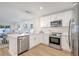 Modern kitchen featuring quartz counters, stainless appliances, and open concept floorplan at 1422 19Th St, Sarasota, FL 34234