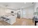 Open kitchen with stainless steel appliances, island seating, and lots of natural light at 1422 19Th St, Sarasota, FL 34234