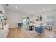 Bright and airy living room with modern furniture, light wood floors, and neutral decor at 1422 19Th St, Sarasota, FL 34234